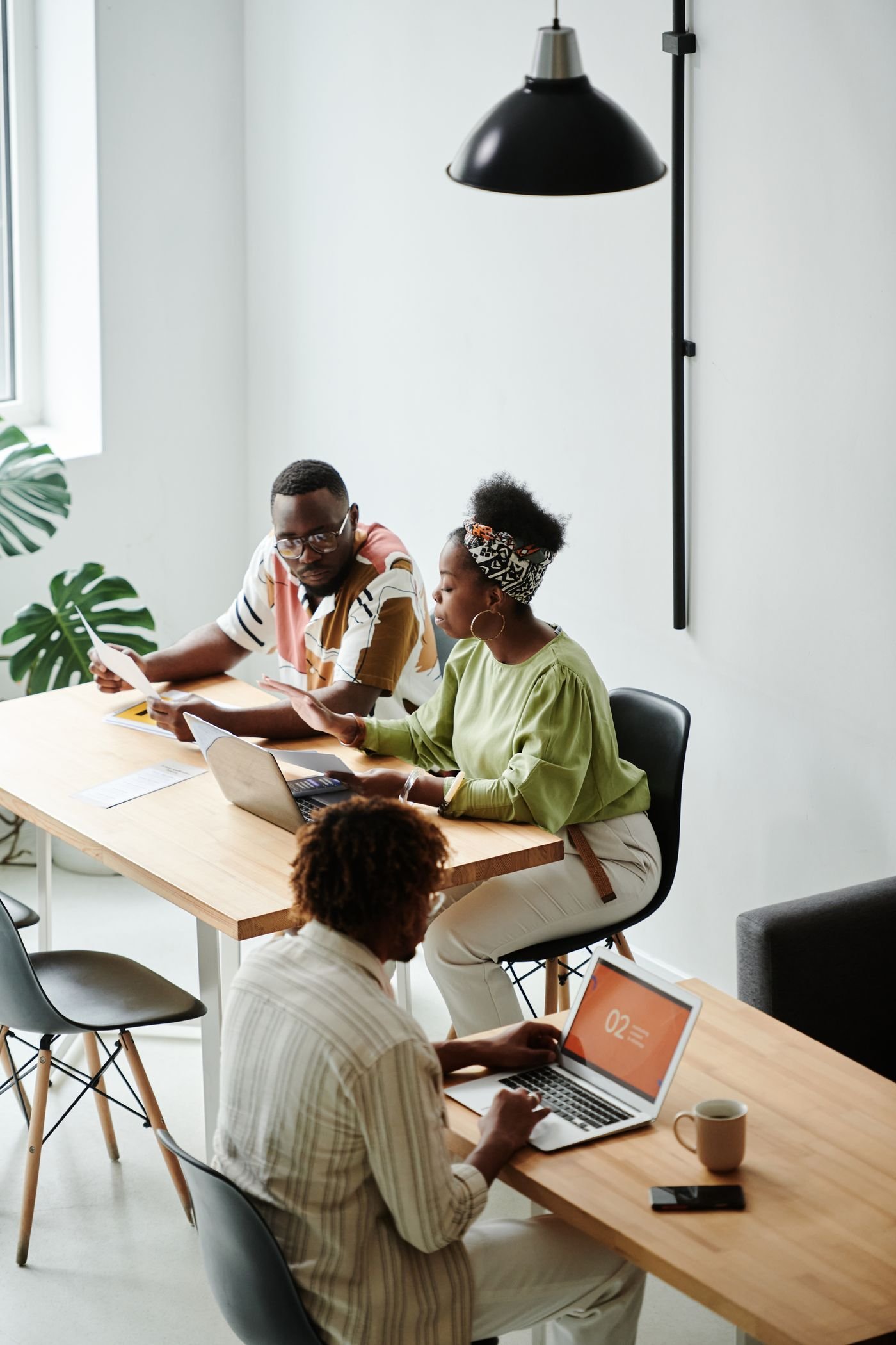 Designers reviewing layouts together at a studio table